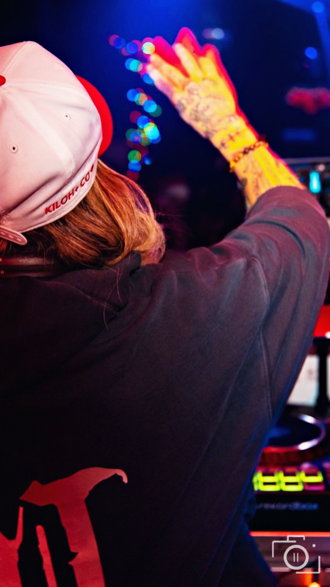 Real Pause Studios luxury and lifestyle content — DJ set with neon crowd energy in a premium nightlife room
