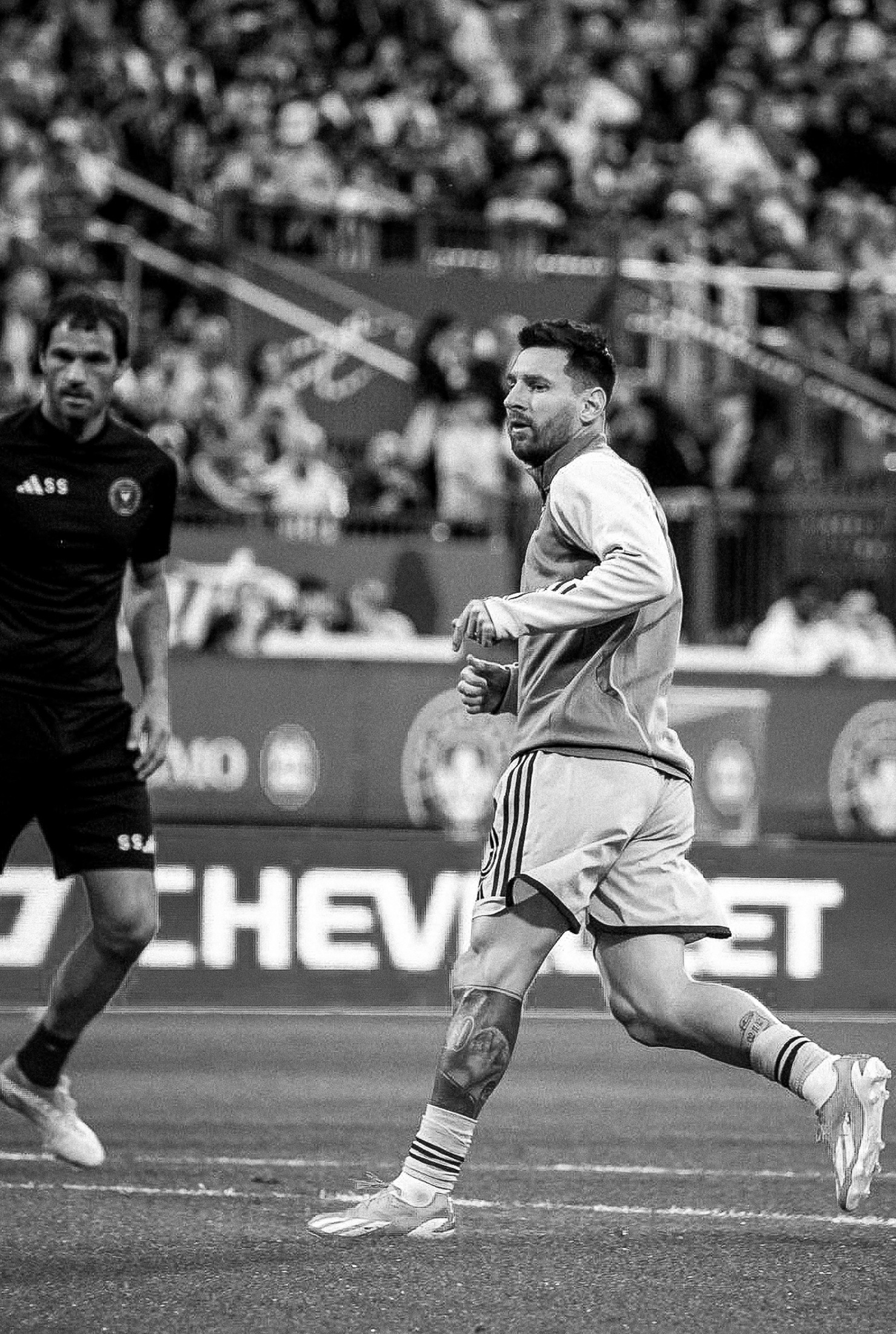 Lionel Messi in motion on the pitch — sports photography by Brian Mullin