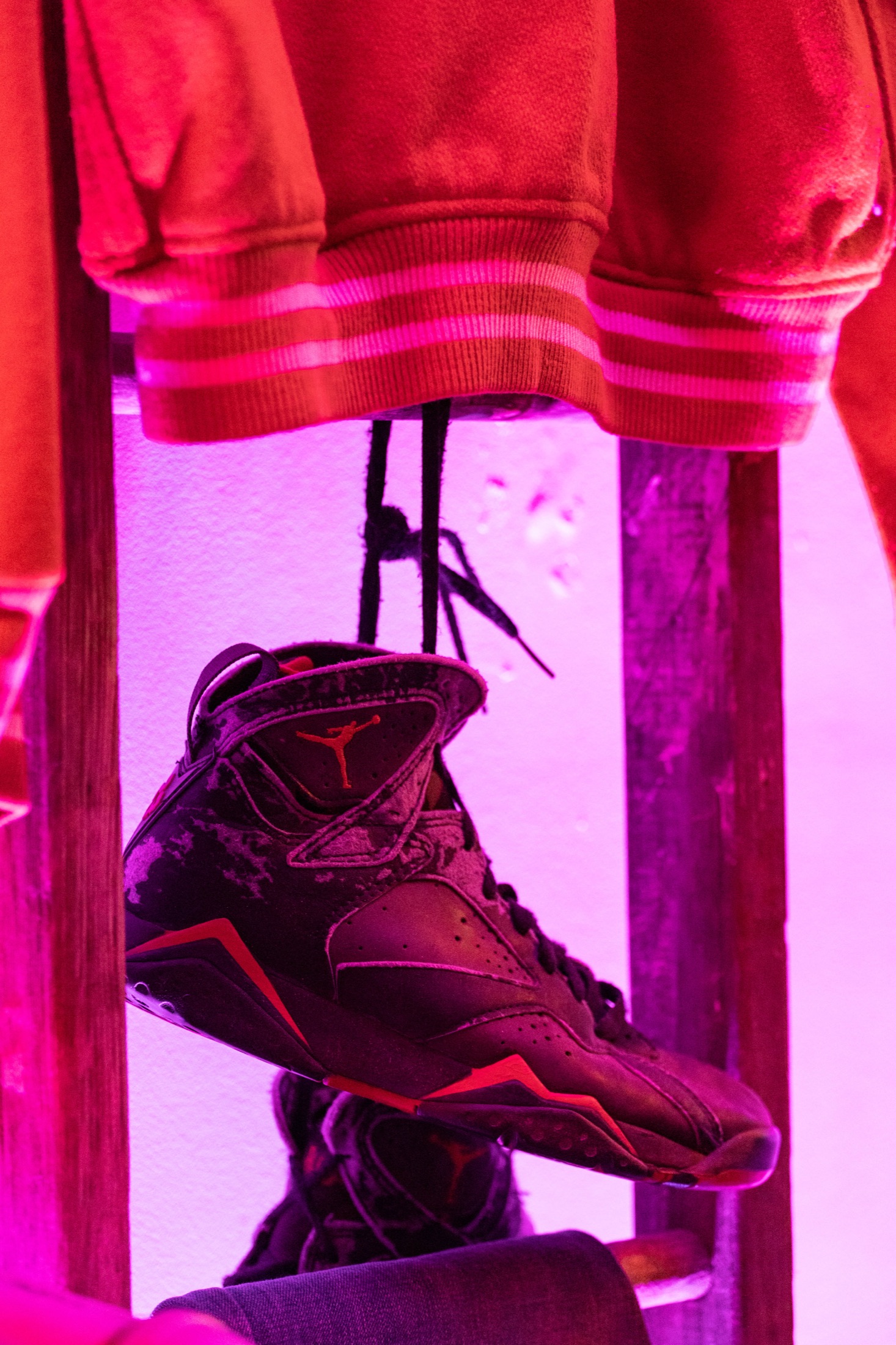 Air Jordan sneaker at a brand activation, magenta lighting — commercial photography by Brian Mullin, Pause Studios