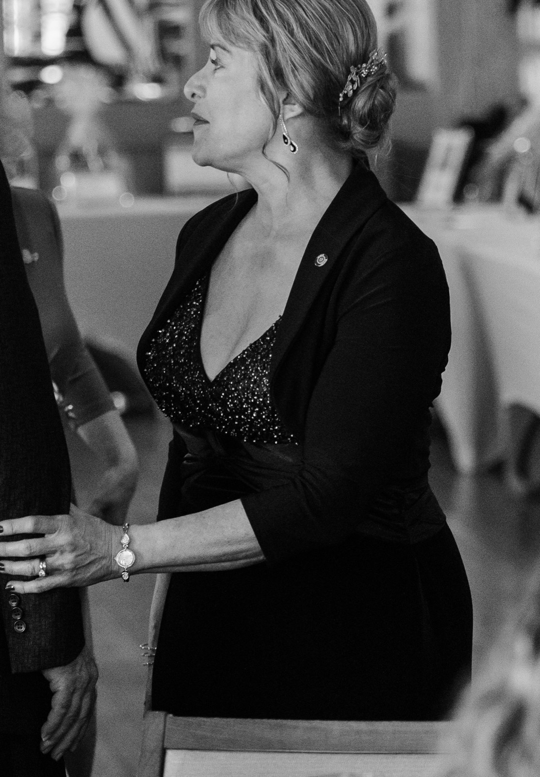 Guests in conversation at a branded networking event. Pause Studios.