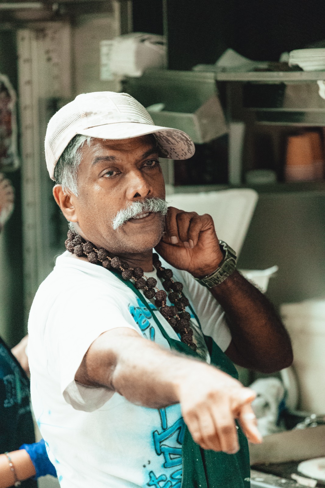 A vendor character moment at a city event, in color. Pause Studios.