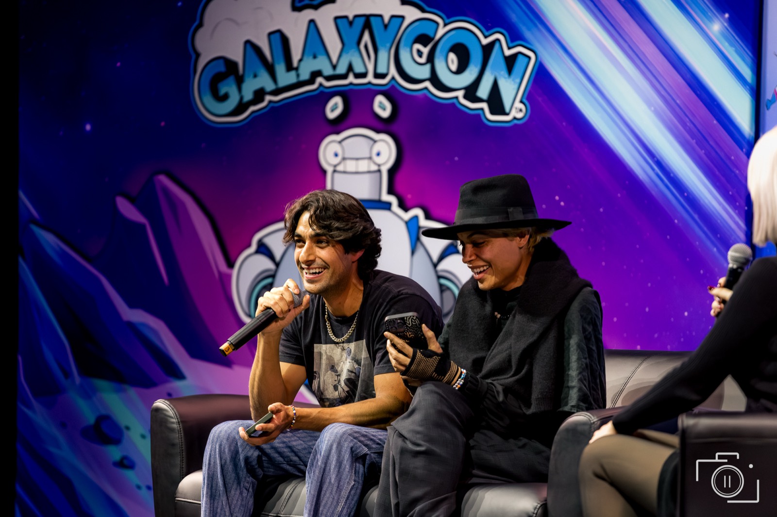 Two featured guests sharing a moment on a convention panel, in color — GalaxyCon. Editorial coverage by Brian Mullin, Pause Studios.