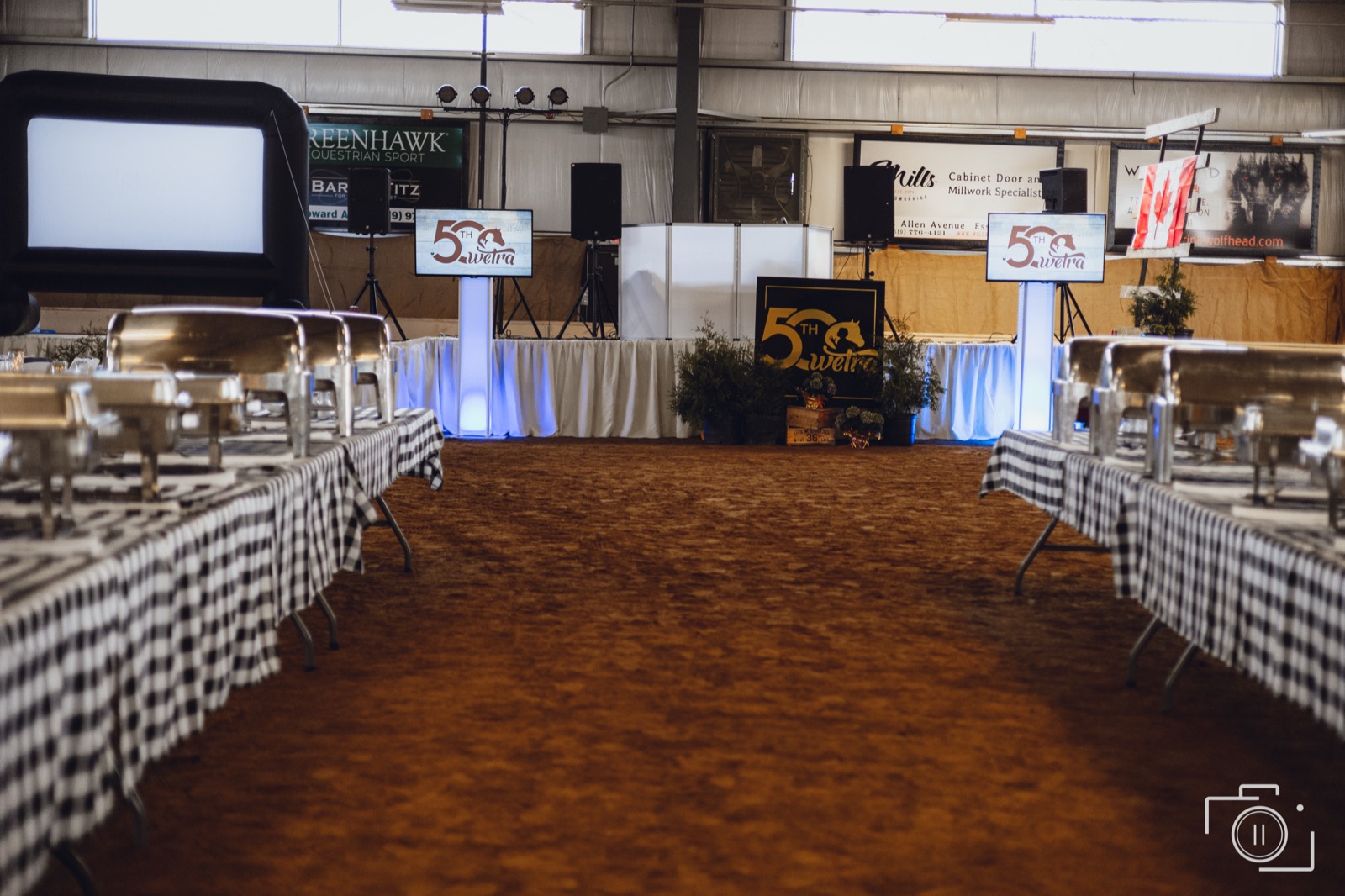 Full gala room mid-program — seated guests, stage, and scale. Pause Studios.