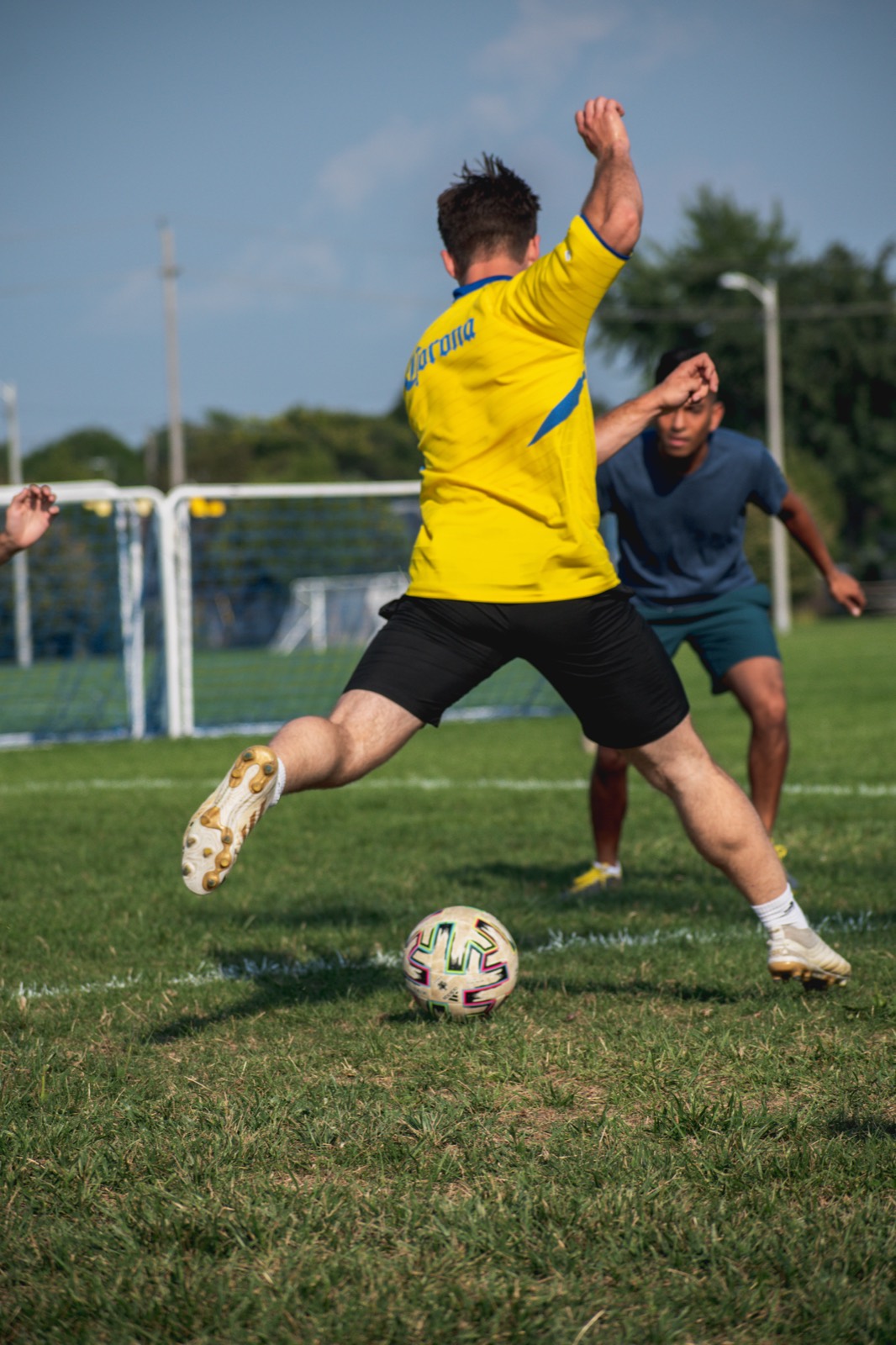Soccer action on the field during a match. Pause Studios.