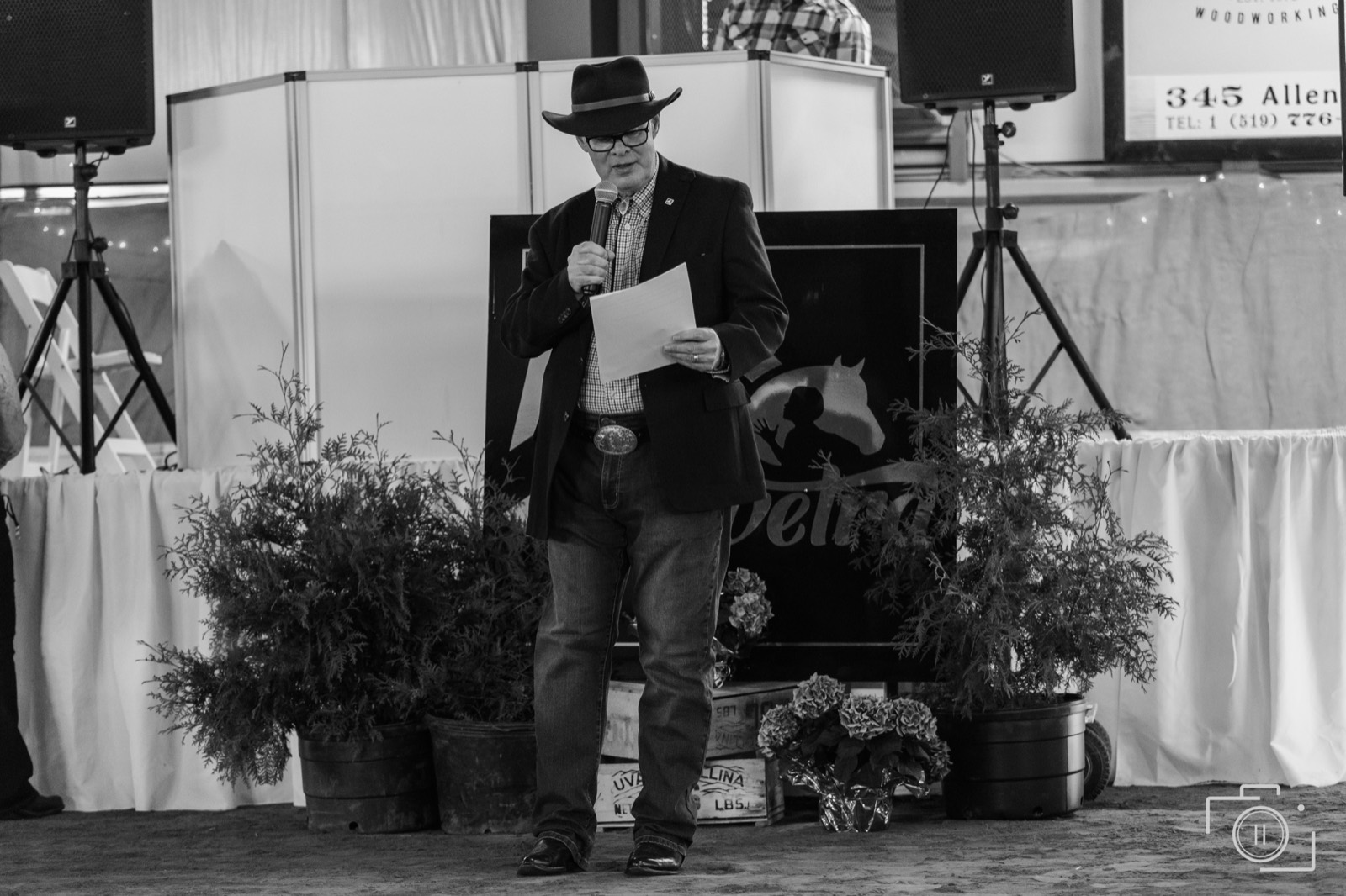 Stage and arena scale at a western-themed event. Pause Studios.