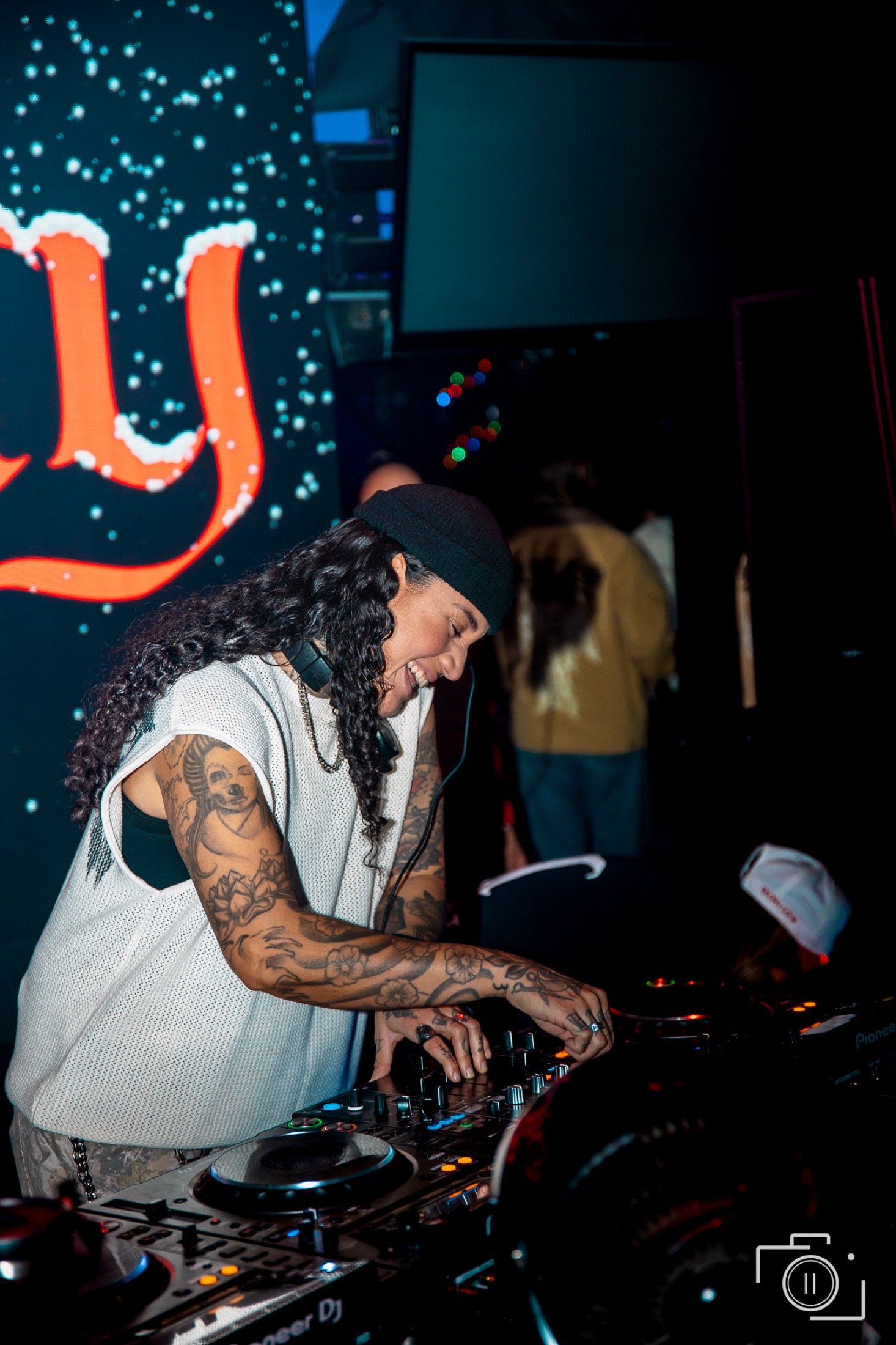 DJ at the decks during a live event — entertainment photography by Brian Mullin