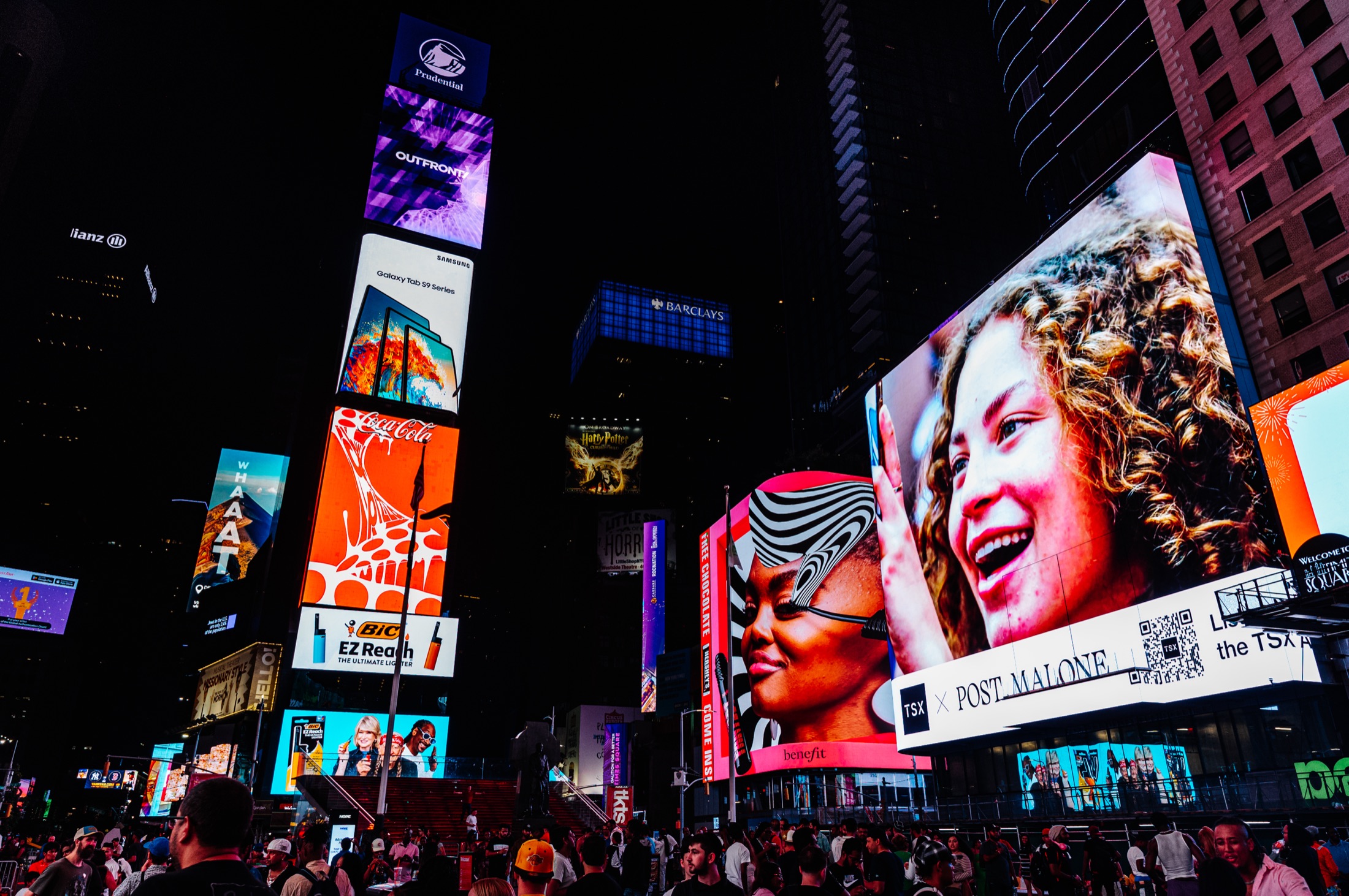 Times Square at night with illuminated billboards and crowd — New York City event photography by Brian Mullin
