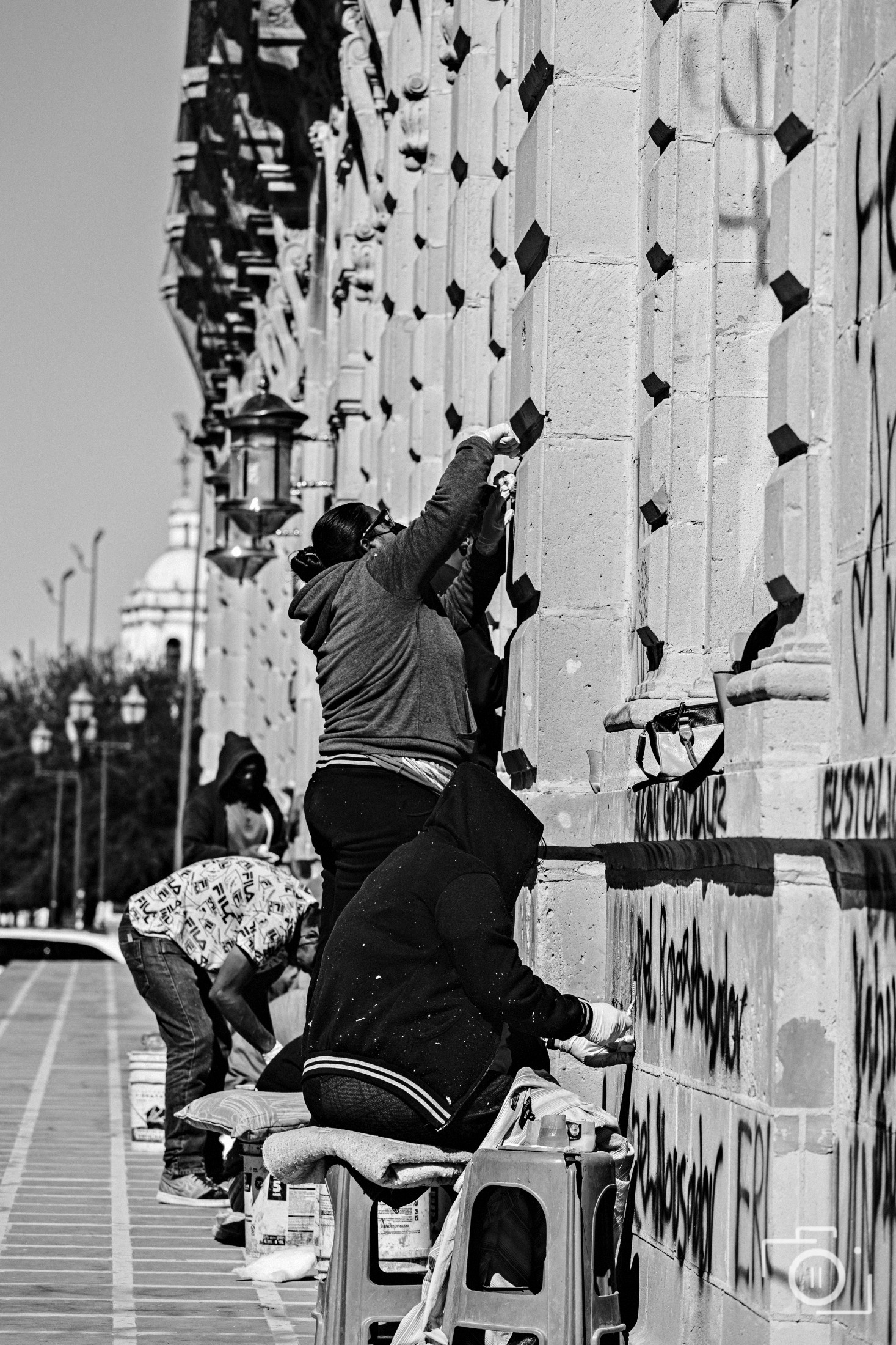 Workers restoring a colonial cathedral facade in Chihuahua, black and white — market-entry coverage by Brian Mullin, Pause Studios.