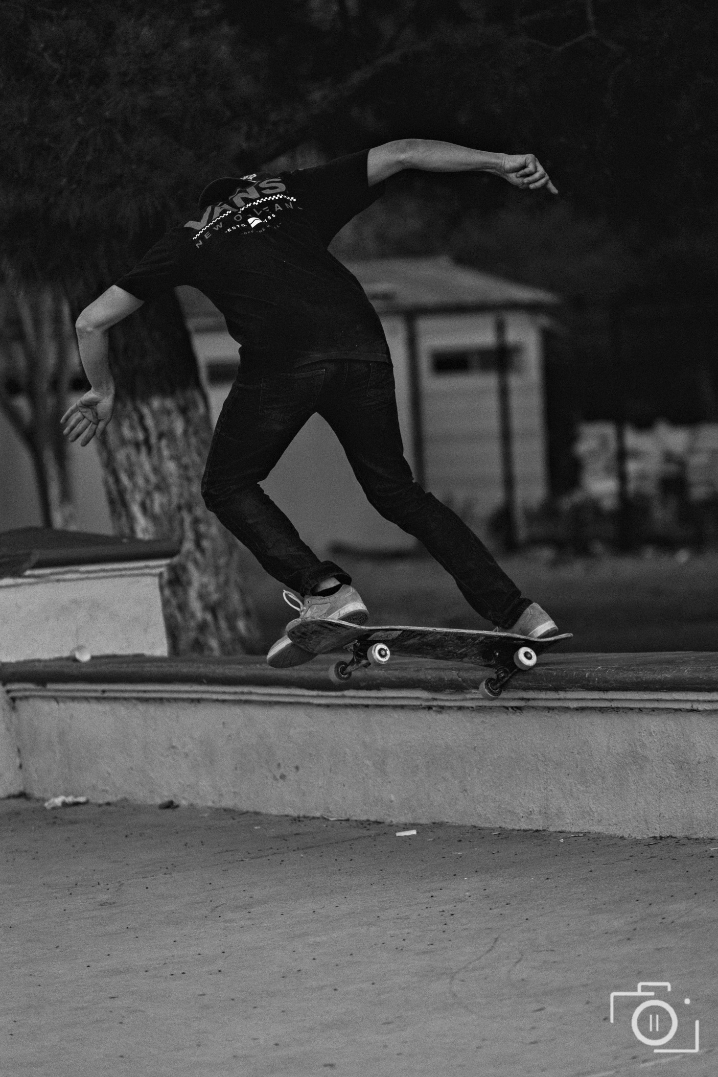 A skateboarder mid-grind on a ledge, black and white, Chihuahua. Photography by Brian Mullin, Pause Studios.