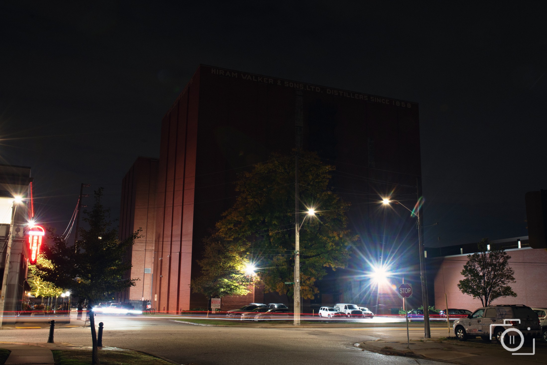 The historic Hiram Walker distillery at night beside the brewery. Photography by Brian Mullin, Pause Studios.