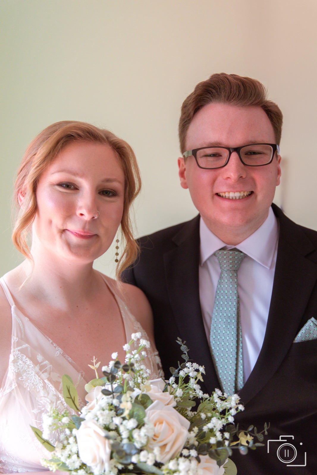 Bride and groom hold each other close at the reception under warm light — documentary wedding coverage by Brian Mullin, Pause Studios.
