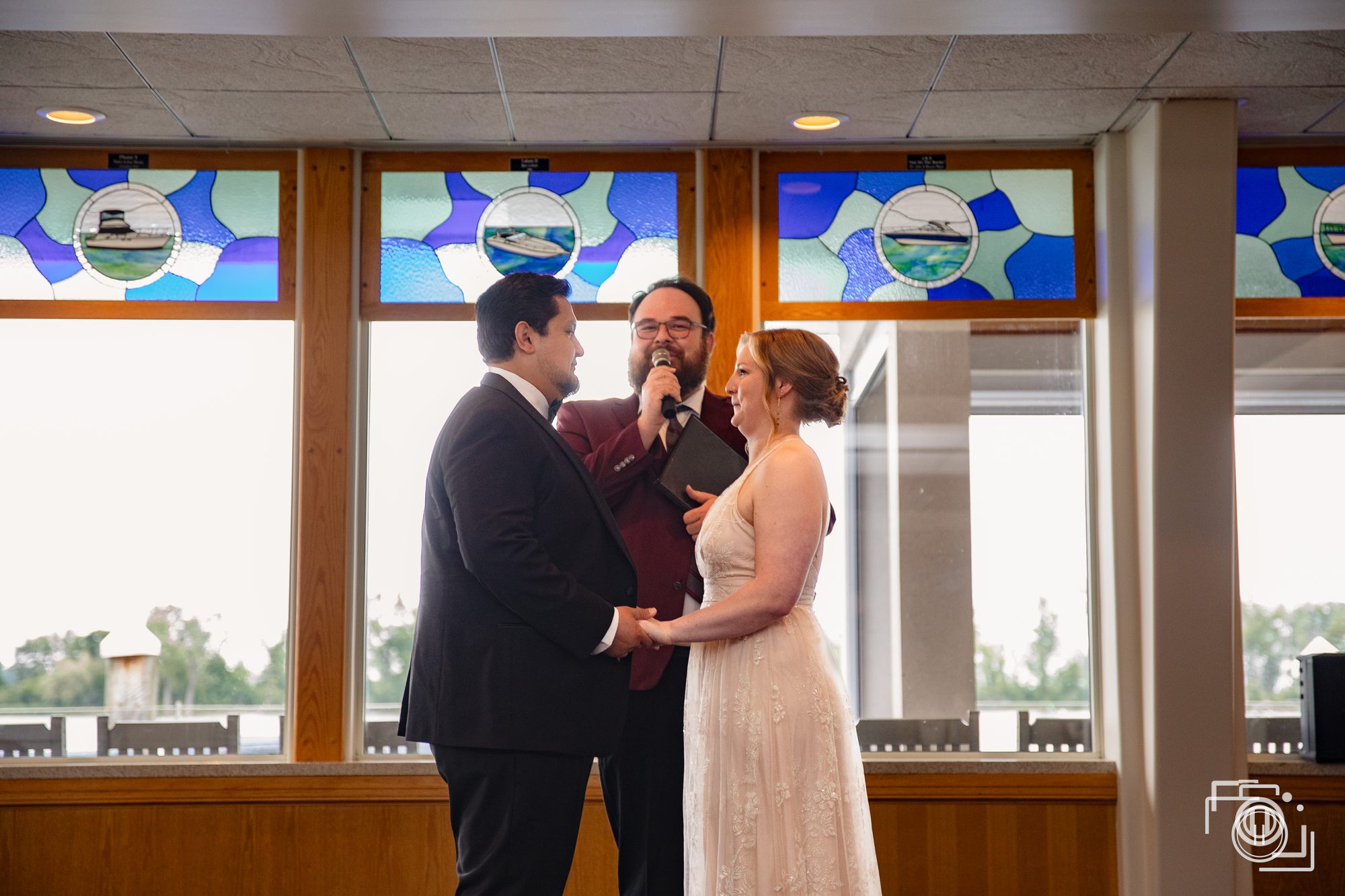 Couple together in soft window light before the ceremony. Candid wedding photography, Pause Studios.
