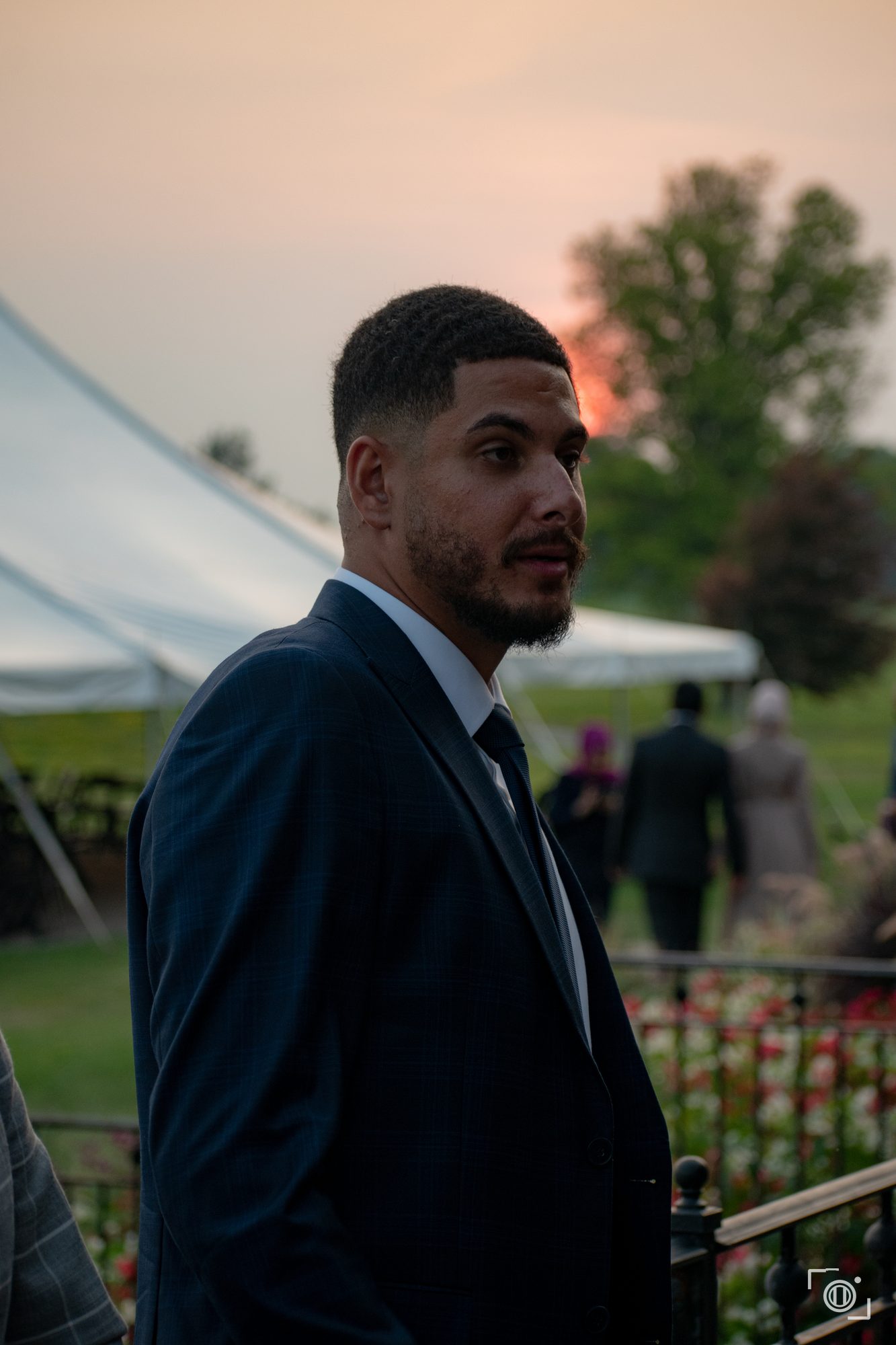 Golden-hour moment outdoors at an intimate wedding. Candid coverage by Brian Mullin, Pause Studios.